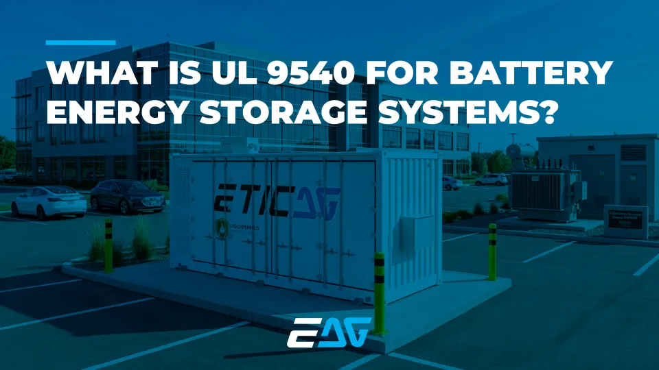 UL 9540 battery energy storage system installed outside a commercial building in a parking area, featuring an EticaAG containerized unit with LiquidShield technology.